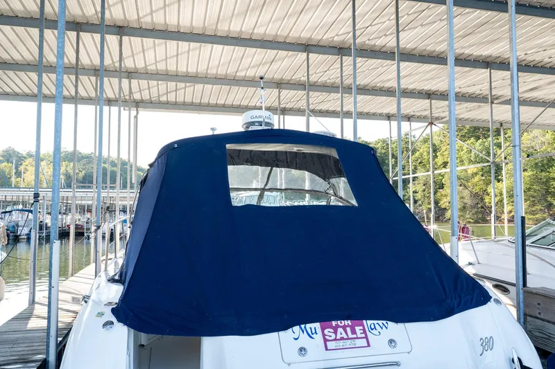 Slide: The Image of 2004 Sea Ray 380 Sundancer yacht with blue cover, docked and for sale. - 27