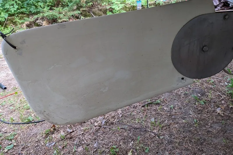 The Image of 1981 McVay Bluenose rudder, displayed outdoors on a grassy surface. - 1