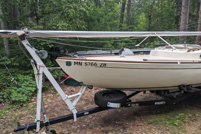 Slide: The Image of 1981 McVay Bluenose sailboat on trailer in wooded area. - 7