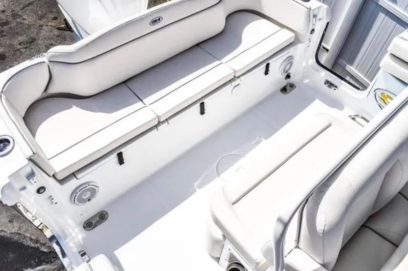 Slide: The Image of 2025 Sea Hunt Ultra 255 SE boat on trailer, rear view showing engine and hull details. - 12