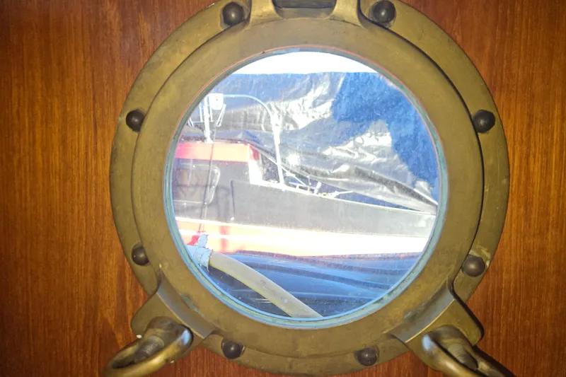 Slide: The Image of Wooden cabinet with drawers and sink in 1981 Nordic Tug Cricket boat kitchen. - 35