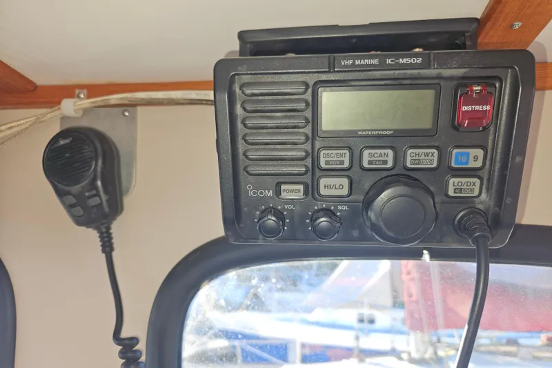 Slide: The Image of 1981 Nordic Tug Cricket interior with wooden paneling and ventilation control. - 42