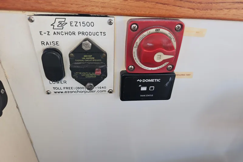 Slide: The Image of Compass on 1981 Nordic Tug Cricket boat, with marina view through window. - 50