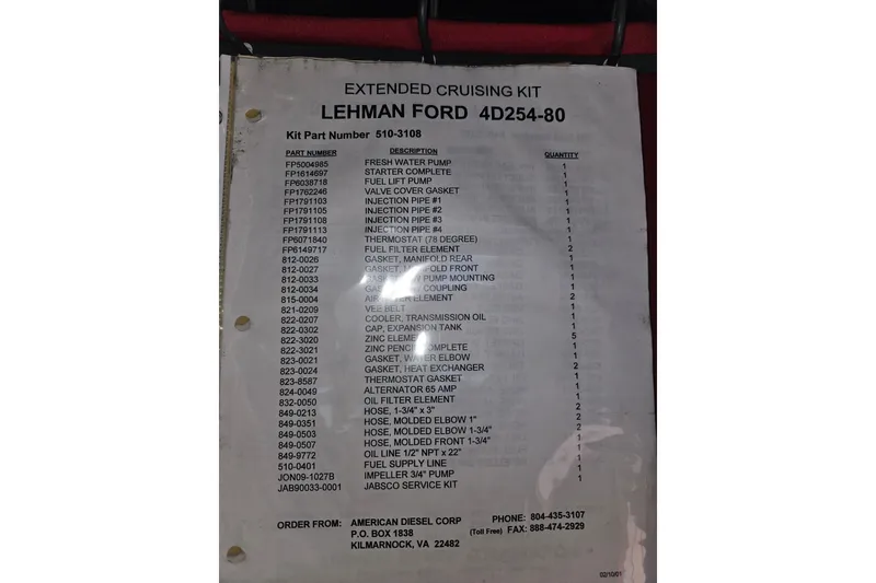 Slide: The Image of Engine compartment of a 1981 Nordic Tug Cricket, featuring a red Lehman Power engine. - 56