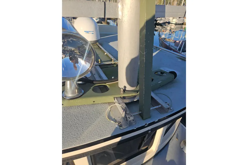 Slide: The Image of 1981 Nordic Tug Cricket boat deck with spotlight and radar equipment. - 68