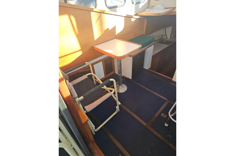 Slide: The Image of View from 1981 Nordic Tug Cricket, overlooking marina with sailboats and clear blue sky. - 26