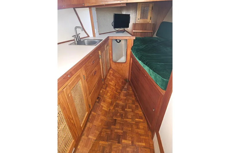 Slide: The Image of Interior of 1981 Nordic Tug Cricket with chair and table setup. - 30