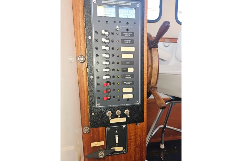 Slide: The Image of RCA monitor and voltmeter on 1981 Nordic Tug Cricket boat dashboard. - 48