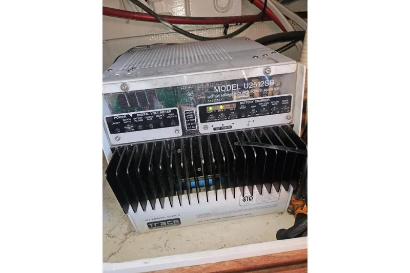 Slide: The Image of Control panel of a 1981 Nordic Tug Cricket boat with wooden steering wheel. - 51