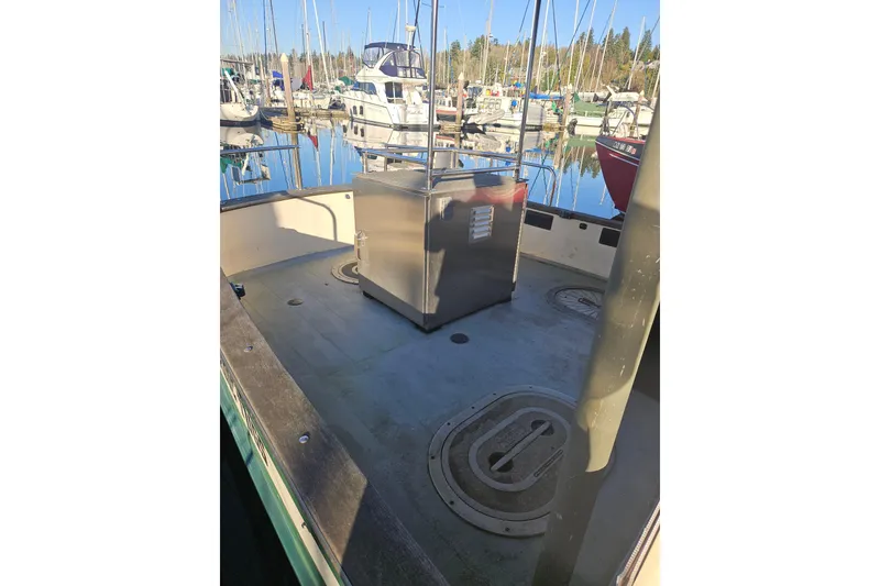 Slide: The Image of Wooden cabinet with wicker doors and drawers inside a 1981 Nordic Tug Cricket boat. - 8