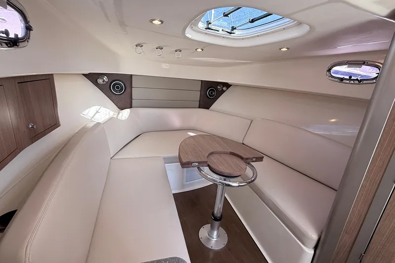 Slide: The Image of Interior of 2018 Boston Whaler 315 Conquest with elegant seating area. - 2