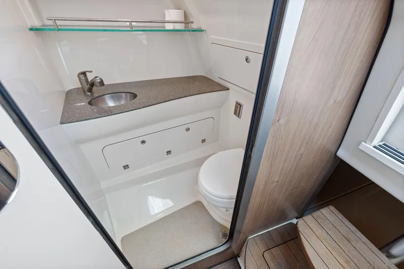 Slide: The Image of 2018 Boston Whaler 315 Conquest bathroom with sink, toilet, and modern design. - 41