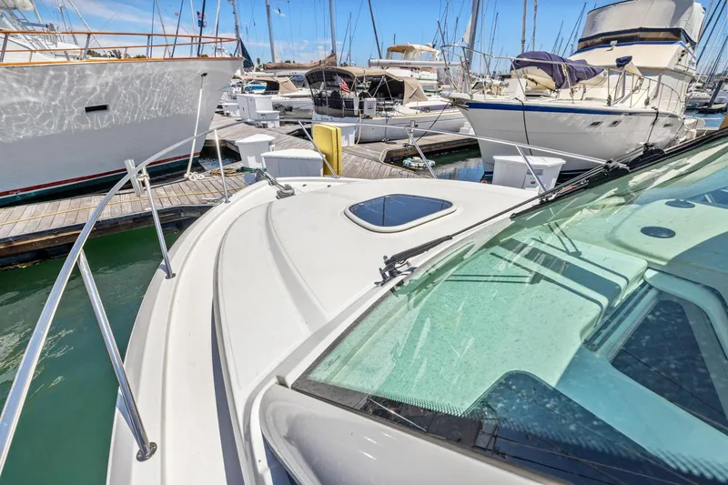Slide: The Image of 2018 Boston Whaler 315 Conquest docked among other boats in a marina. - 29