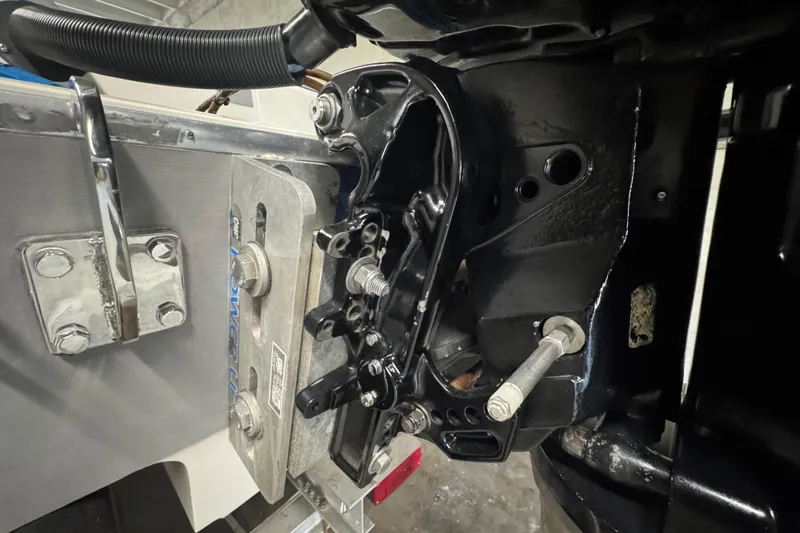 Slide: The Image of Close-up of a 1990 Skater 24 boat engine mount and hardware components. - 17