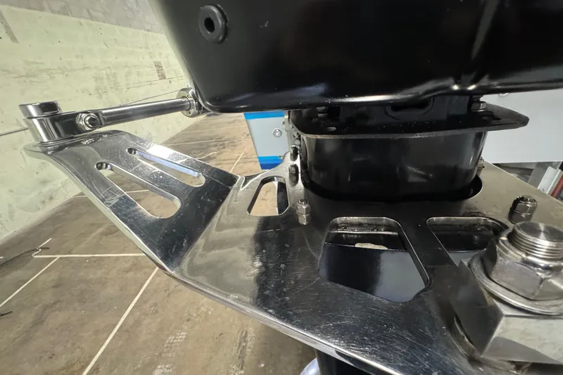 Slide: The Image of Close-up of Skater 24 boat engine mount, showcasing metallic components, 1990 model. - 18