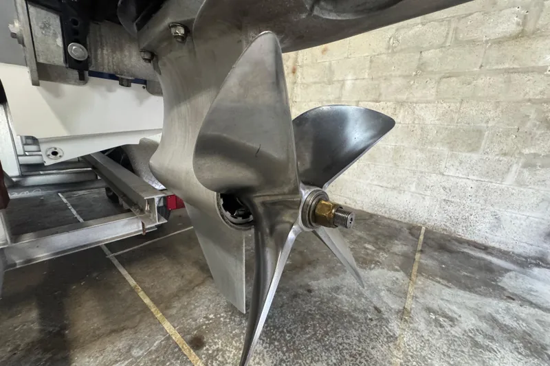 Slide: The Image of Close-up of a Skater 24 boat propeller, model year 1990, in a garage setting. - 21