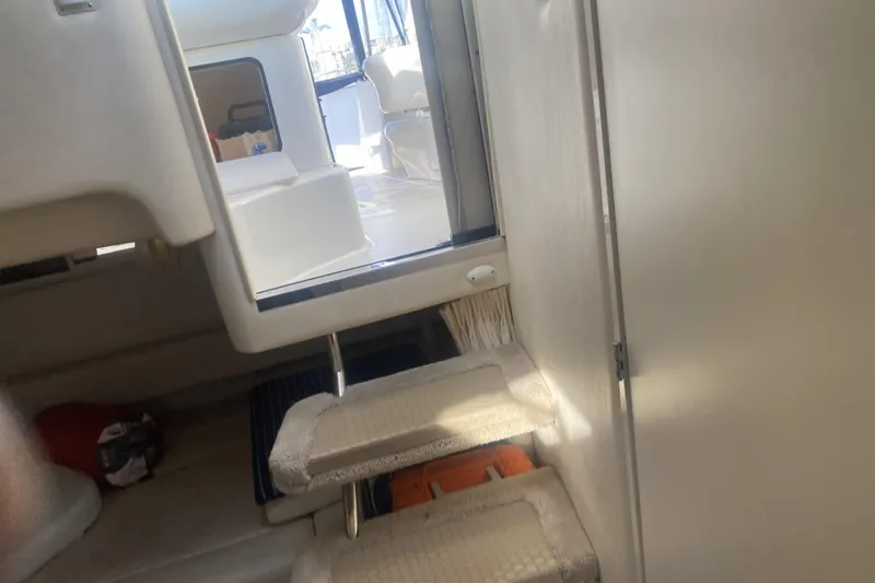 Slide: The Image of Interior view of 1998 Searay Sundancer boat, showing steps and cabin entrance. - 9