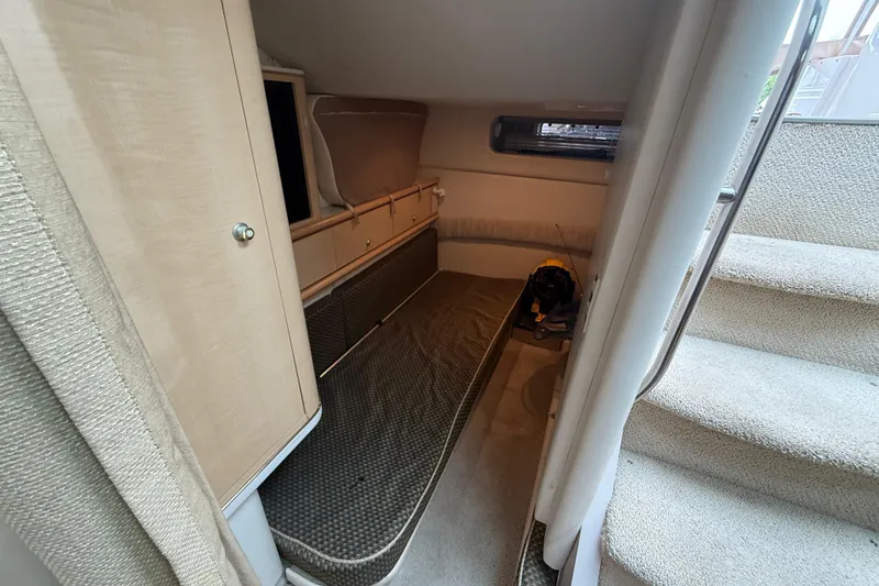 Slide: The Image of Interior cabin of 2000 Maxum 3700 SCR yacht with cozy sleeping area and stairs. - 10