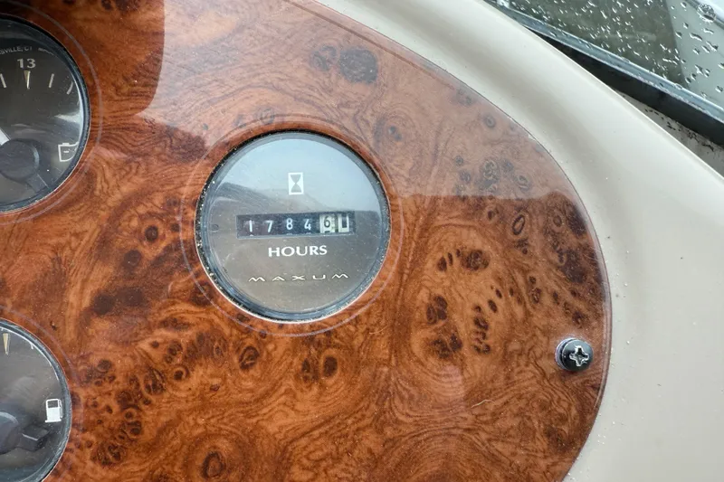 Slide: The Image of Maxum 3700 SCR 2000 dashboard with hour meter reading 1784.6 hours. - 12