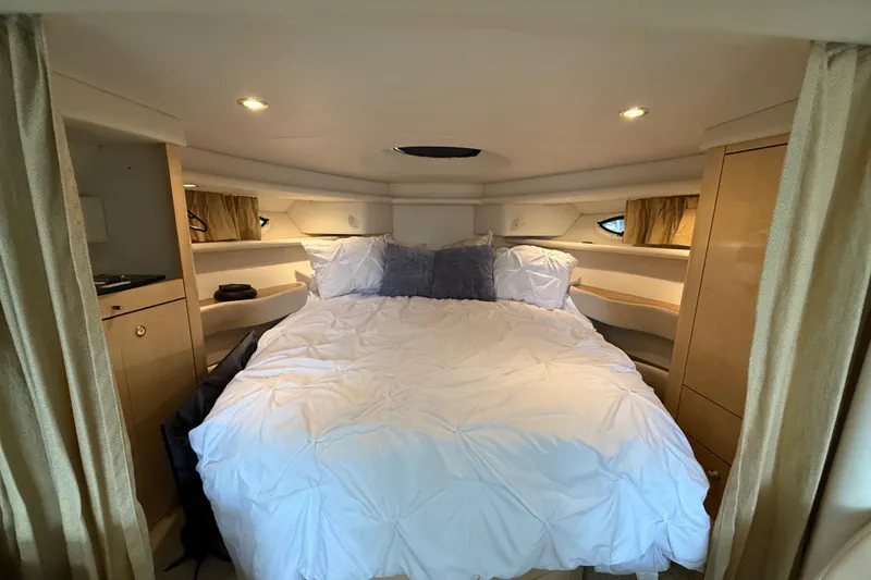 Slide: The Image of Luxurious cabin interior of 2000 Maxum 3700 SCR yacht with cozy bedding. - 5