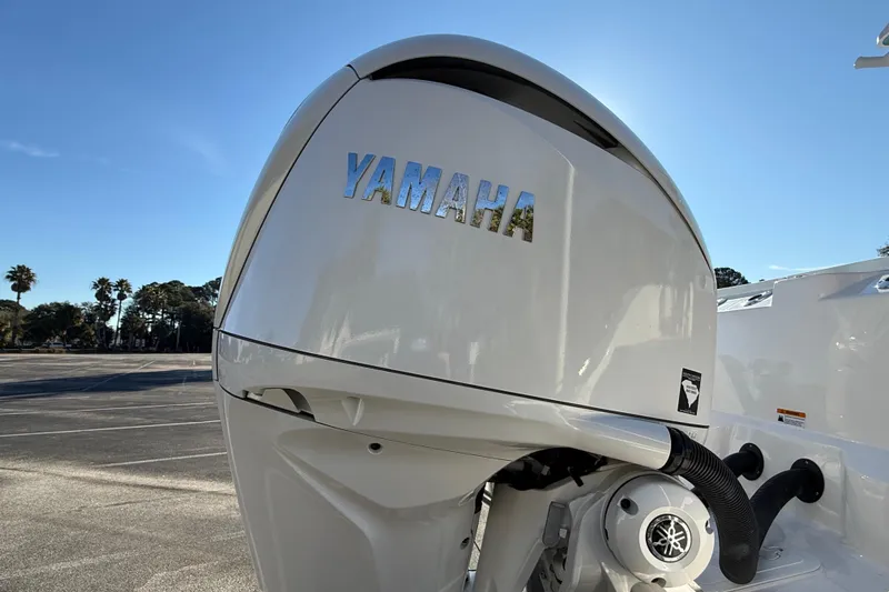 Slide: The Image of 2024 Sea Fox 288 Commander with Yamaha outboard engine in a sunny parking lot. - 10