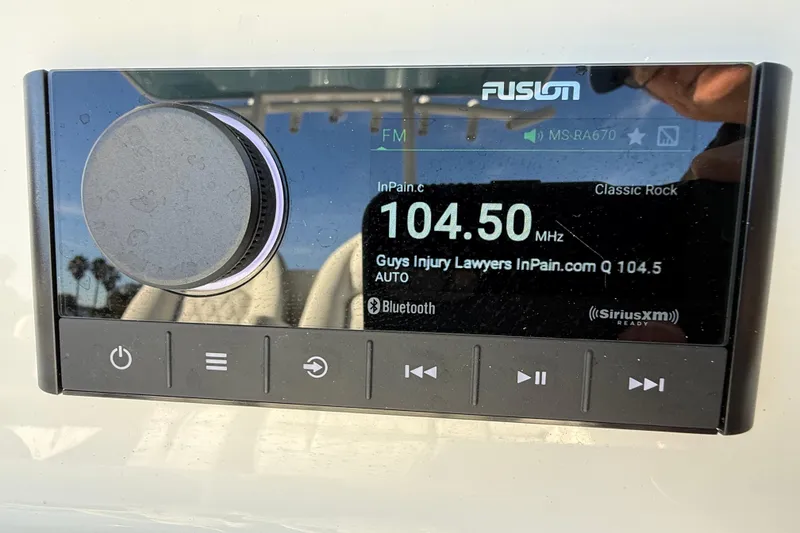 Slide: The Image of Fusion marine stereo on 2024 Sea Fox 288 Commander, tuned to 104.5 MHz classic rock station. - 15