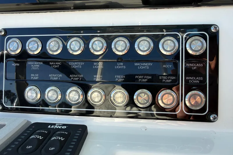 Slide: The Image of Control panel of 2024 Sea Fox 288 Commander boat with labeled buttons and switches. - 16