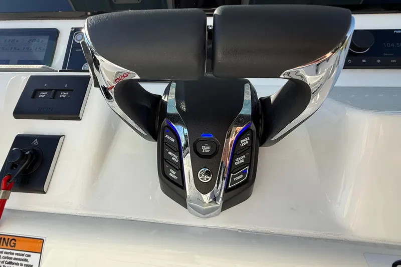 Slide: The Image of 2024 Sea Fox 288 Commander boat controls with advanced throttle system and digital display. - 17