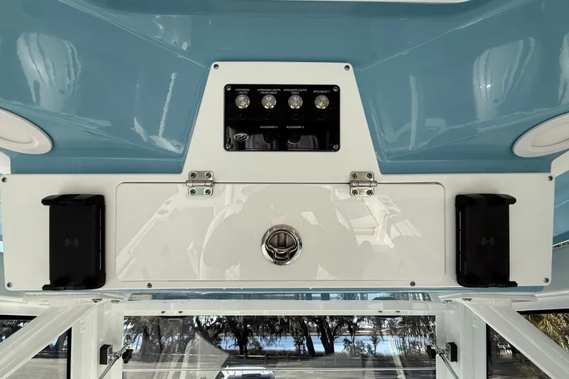 Slide: The Image of 2024 Sea Fox 288 Commander boat dashboard with control panel and storage compartment. - 19