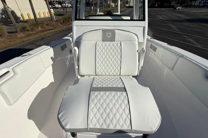Slide: The Image of 2024 Sea Fox 288 Commander boat interior with white cushioned seating. - 27