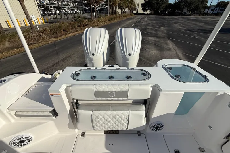 Slide: The Image of 2024 Sea Fox 288 Commander boat interior with dual engines and seating area. - 28