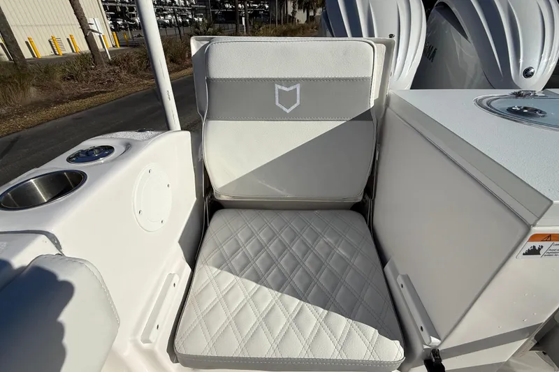 Slide: The Image of 2024 Sea Fox 288 Commander boat seat with diamond-stitched upholstery and cup holder. - 30