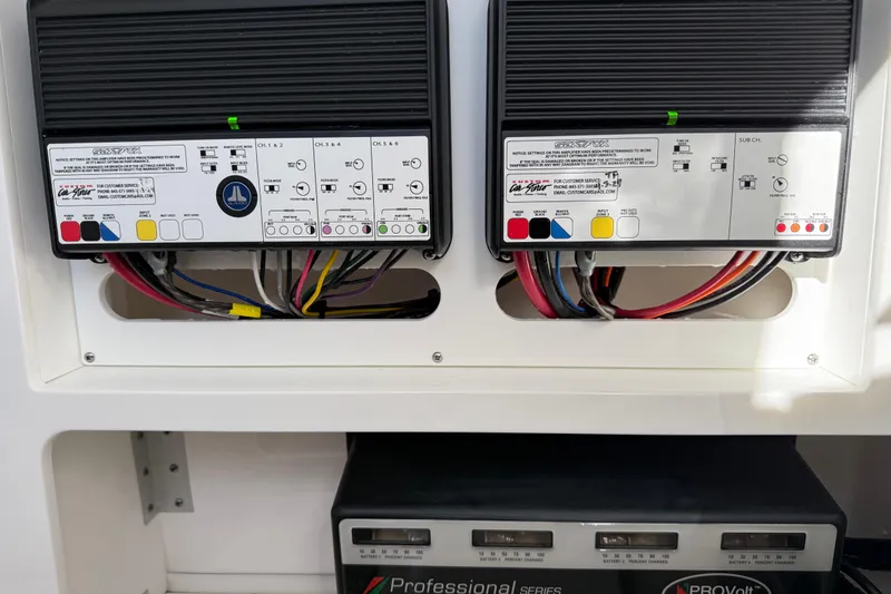 Slide: The Image of 2024 Sea Fox 288 Commander electrical panel with wiring and battery charger. - 38