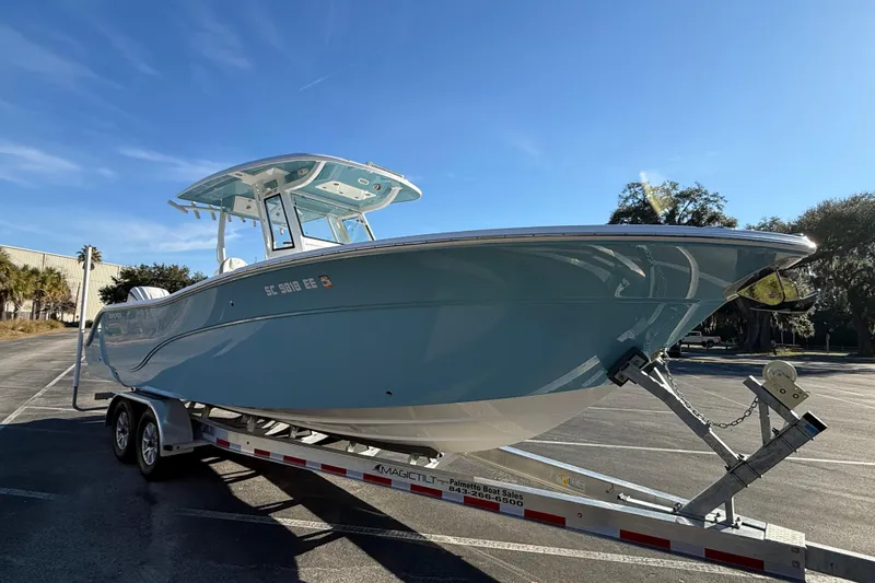 Slide: The Image of 2024 Sea Fox 288 Commander boat on trailer under clear blue sky. - 7