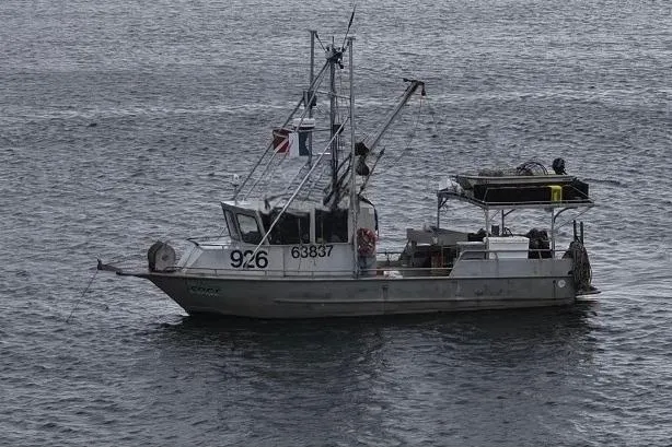 The Image of 1992 Munson 38’ Aluminum Commercial Dive boat on calm water. - 1