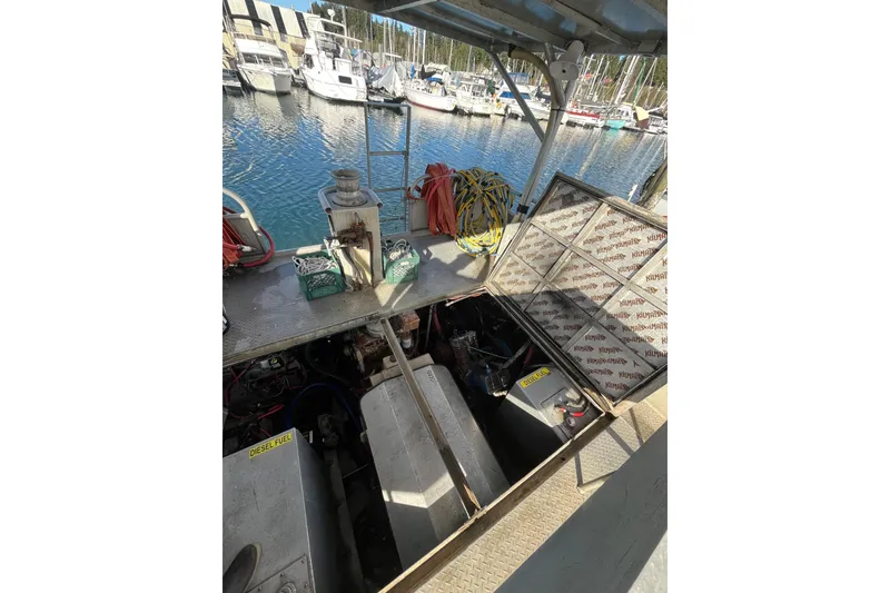 Slide: The Image of 1992 Munson 38’ Aluminum Commercial Dive boat engine compartment, docked at marina. - 7