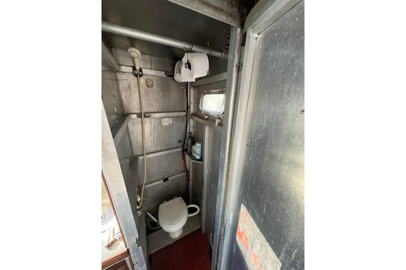 Slide: The Image of Interior of 1992 Munson 38’ Aluminum Commercial Dive boat bathroom with shower and toilet. - 9
