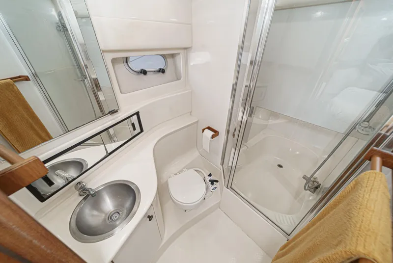 Slide: The Image of 1998 Bayliner 3988 Motoryacht bathroom with sink, toilet, and shower. - 18