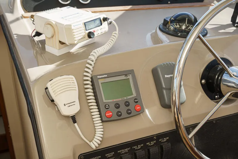 Slide: The Image of Control panel of a 1998 Bayliner 3988 Motoryacht with radio and navigation equipment. - 23
