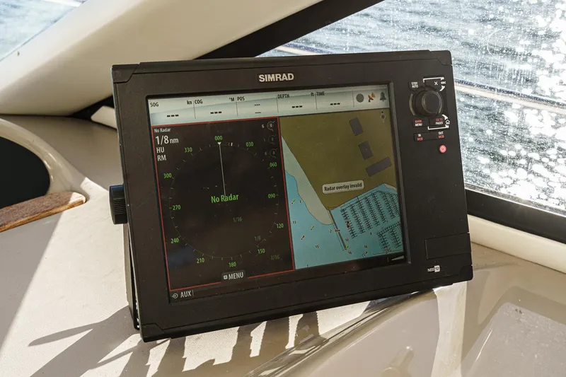 Slide: The Image of Simrad navigation system on 1998 Bayliner 3988 Motoryacht, displaying nautical map and radar. - 24