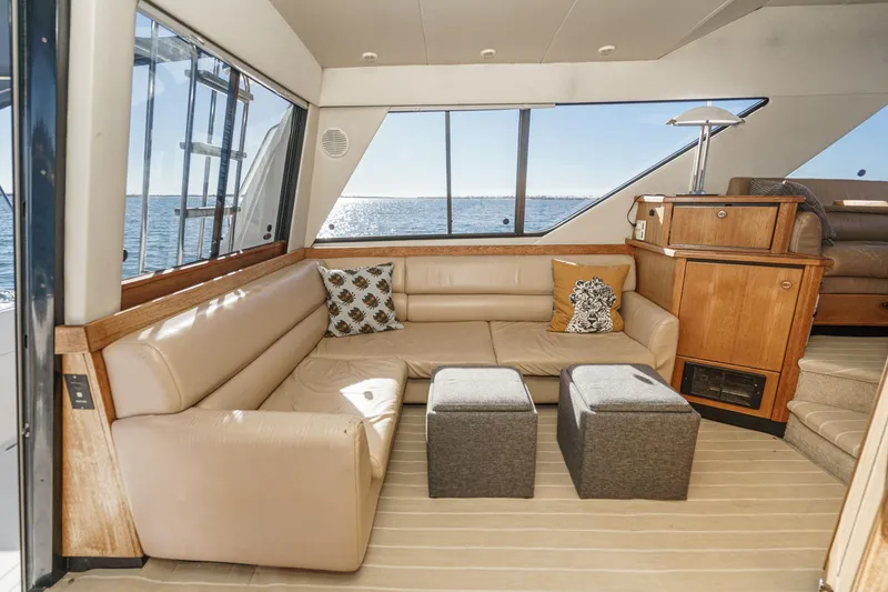 Slide: The Image of Luxurious interior of 1998 Bayliner 3988 Motoryacht with beige seating and ocean view. - 37