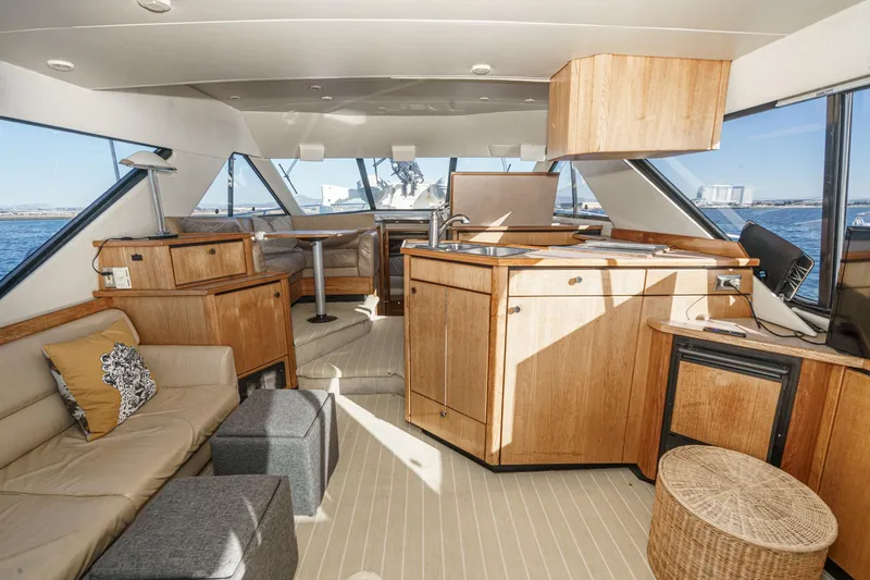 Slide: The Image of Luxurious interior of 1998 Bayliner 3988 Motoryacht with wood cabinetry and panoramic windows. - 38