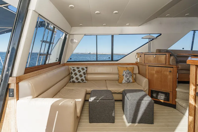 Slide: The Image of Luxurious interior of 1998 Bayliner 3988 Motoryacht with beige seating and ocean view. - 41