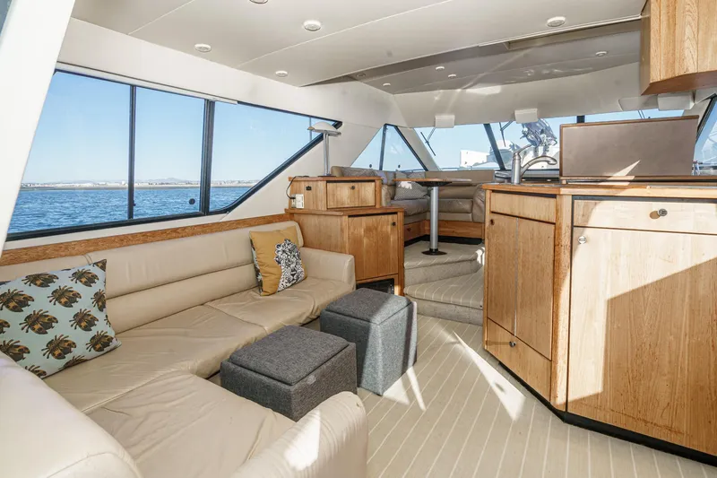 Slide: The Image of Luxurious interior of 1998 Bayliner 3988 Motoryacht with elegant wood finishes and comfortable seating. - 42