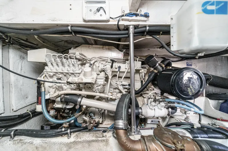 Slide: The Image of Engine compartment of 1998 Bayliner 3988 Motoryacht, showcasing detailed mechanical components. - 8