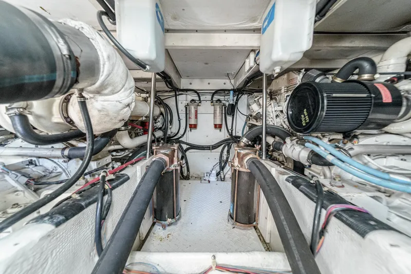 Slide: The Image of Engine room of a 1998 Bayliner 3988 Motoryacht, showcasing mechanical components and systems. - 9