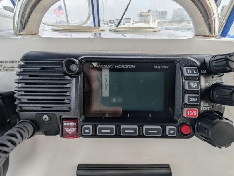 Slide: The Image of Standard Horizon Matrix radio on 1999 Silverton 351 Sedan Cruiser dashboard. - 13