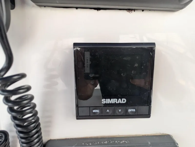 Slide: The Image of Simrad marine display on 1999 Silverton 351 Sedan Cruiser dashboard. - 14