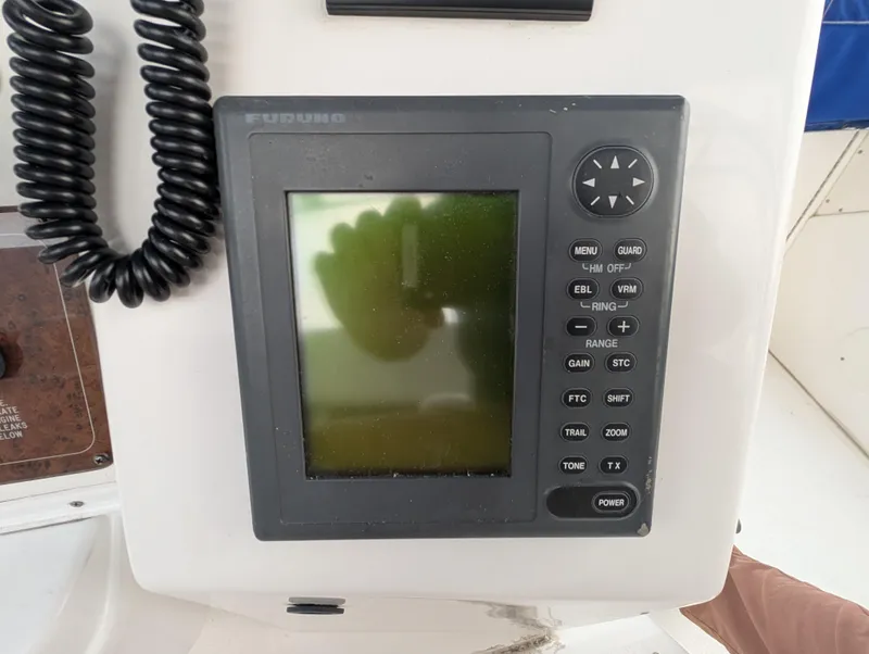 Slide: The Image of Furuno marine navigation system on 1999 Silverton 351 Sedan Cruiser dashboard. - 15