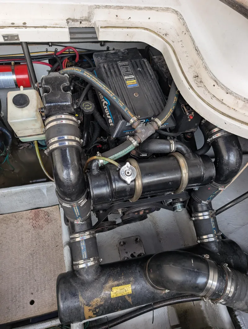 Slide: The Image of Engine compartment of a 1999 Silverton 351 Sedan Cruiser with visible components and hoses. - 18